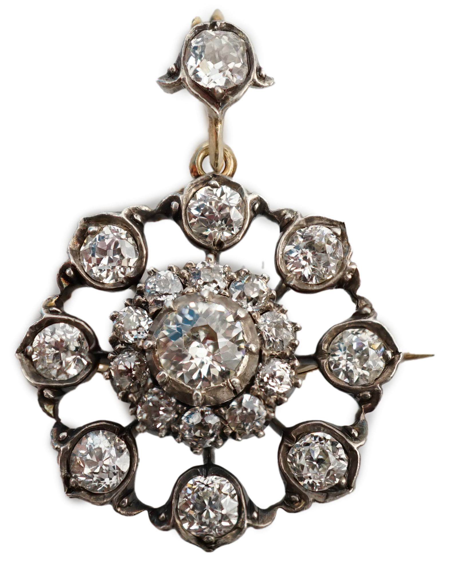 An early 20th century gold and silver mounted diamond cluster set circular pendant brooch